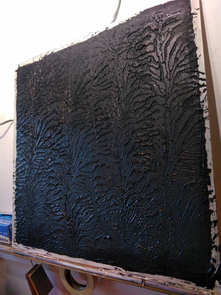 Black Marmorino with a tiger print, two coats of black wax — and a smidgen of good old glitter.