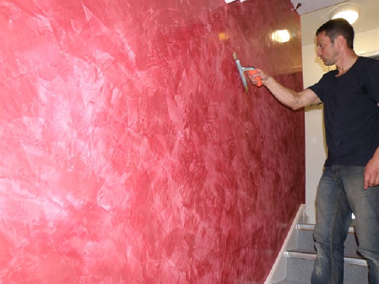 The same wall closer in — the sheen is in the plaster, not a varnish over it.
