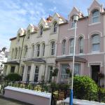 The rendered Victorian terrace on Grosvenor Road, the pink house in the centre