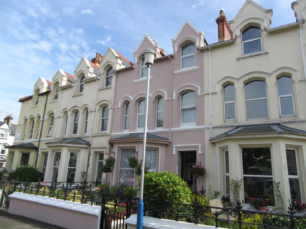 The rendered Victorian terrace on Grosvenor Road, the pink house in the centre