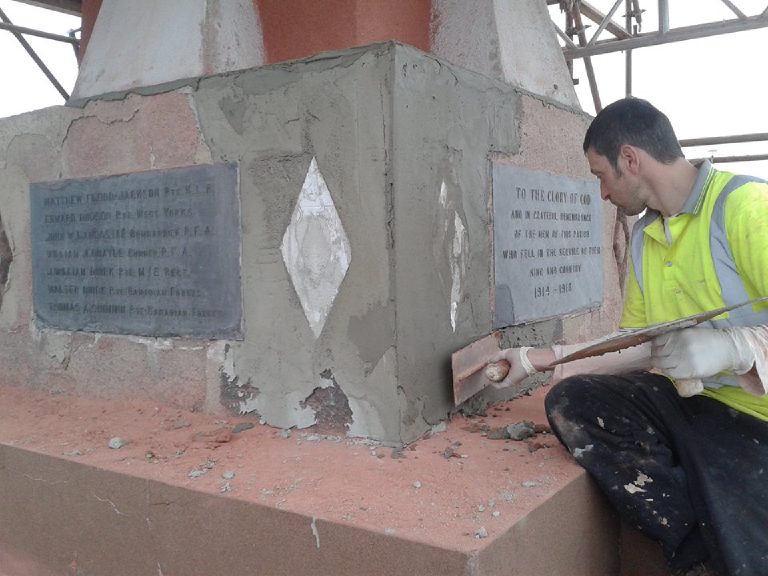 Floating base coat onto the plinth by hand, working up to the plaque
