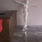 The mosaic statue sparkling beside the bronze bar