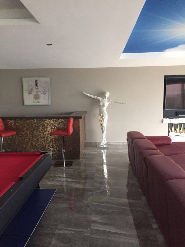 The finished games room with bar, pool table and sky ceiling