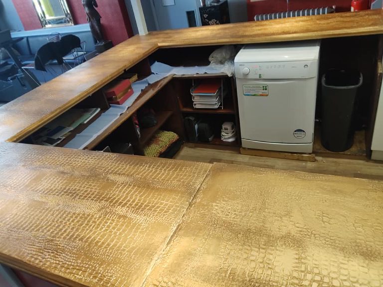 The finished bar top from the customer side, looking into the open back of the bar