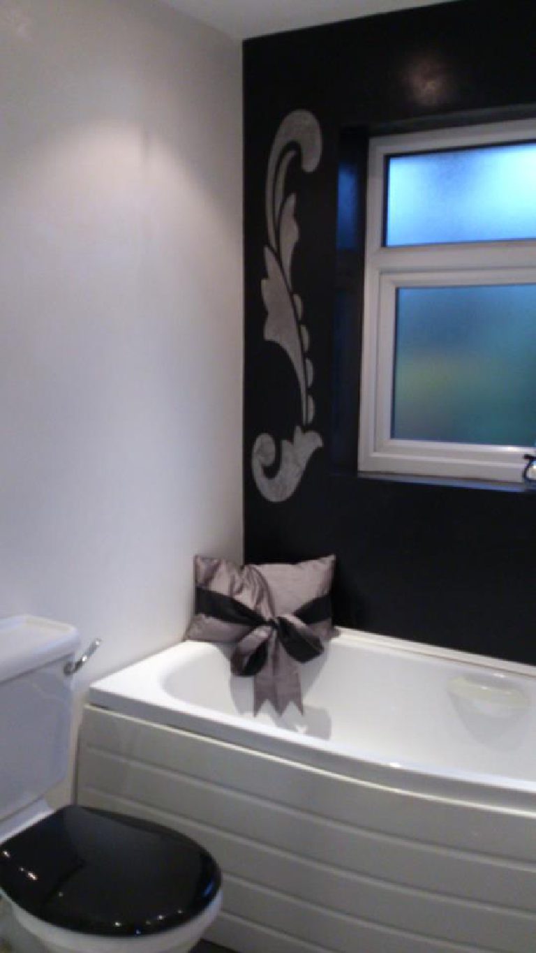 Black Marmorino featuring a stone coloured stencil, giving a stunning contrast