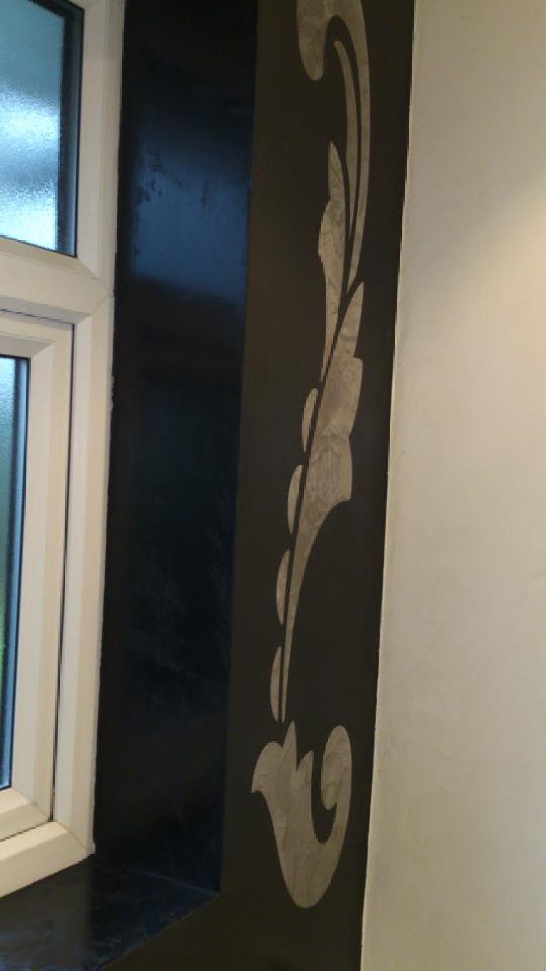 Black Marmorino featuring a stone coloured stencil