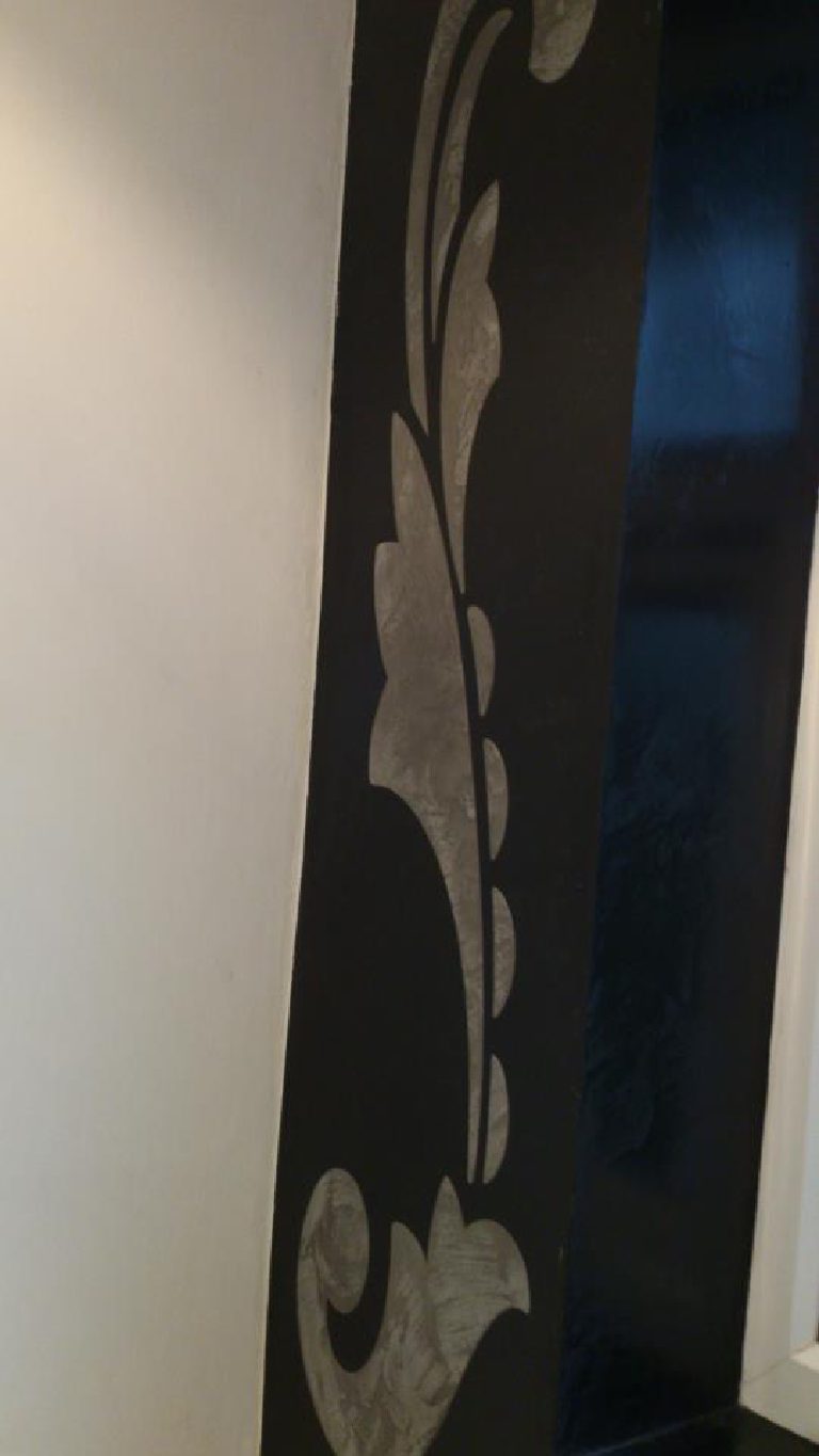 Black Marmorino featuring a stone coloured stencil