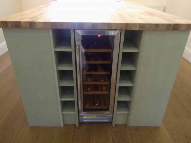 The bespoke island in bare board, wine cabinet fitted, before any finish