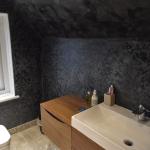 Black Marmorino walls and ceiling with pearlescent shimmer in the finished en-suite
