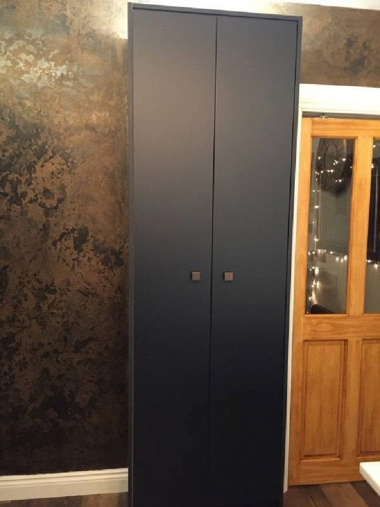 The mottled bronze surface of the feature wall