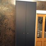 The bronze-waxed black Marmorino up close beside the door