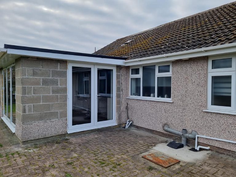The rear corner before, bare blockwork on the extension and spar dash on the original wall
