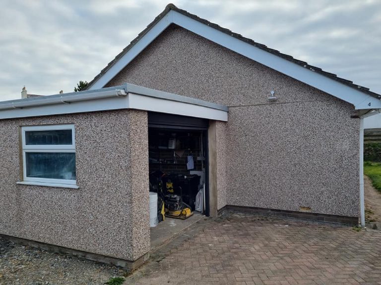 The garage before, in spar dash, with the up-and-over door open