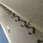 Coat hooks running the length of the glittered corridor wall