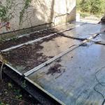The old flat glazed roof before the work, covered in moss, leaf litter and dead twigs