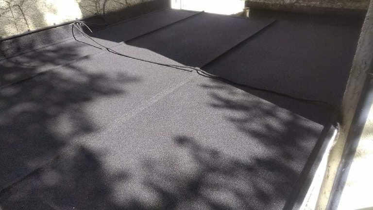 The finished roof with tree shadow falling across the panels