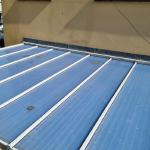 The old blue polycarbonate conservatory roof before the work