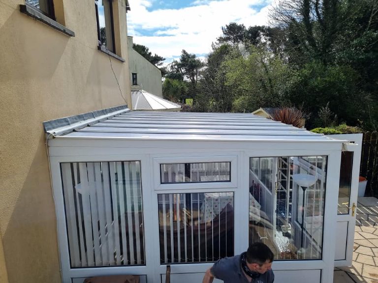 The other conservatory roof before the coating, still in its original white panels