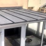 The finished conservatory roof in light grey ThermoCork, seen from an upstairs window