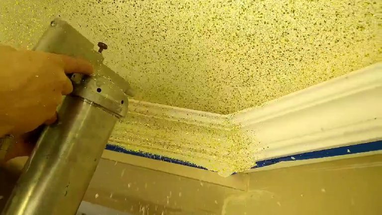 The flake gun working along the line of the coving