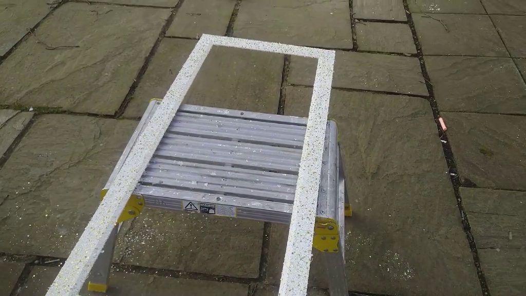 The client's old picture frame sprayed white with gold flakes