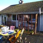 The back of the bungalow before and after the cork render went on