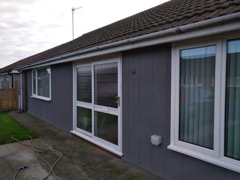 The rear of the bungalow fully rendered, seen along the patio