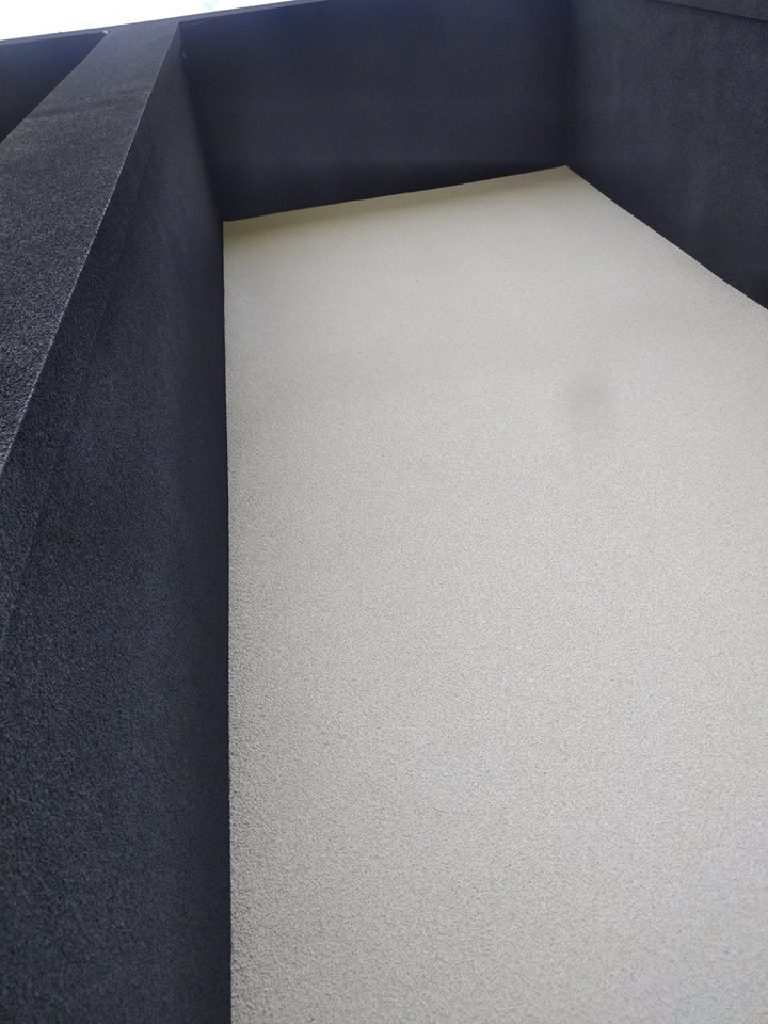 A clean rendered corner where the dark meets the pale panel