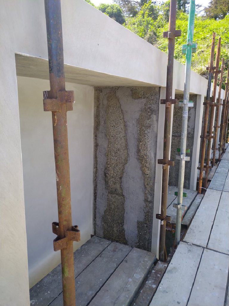 The first coat of cork render going onto the wall