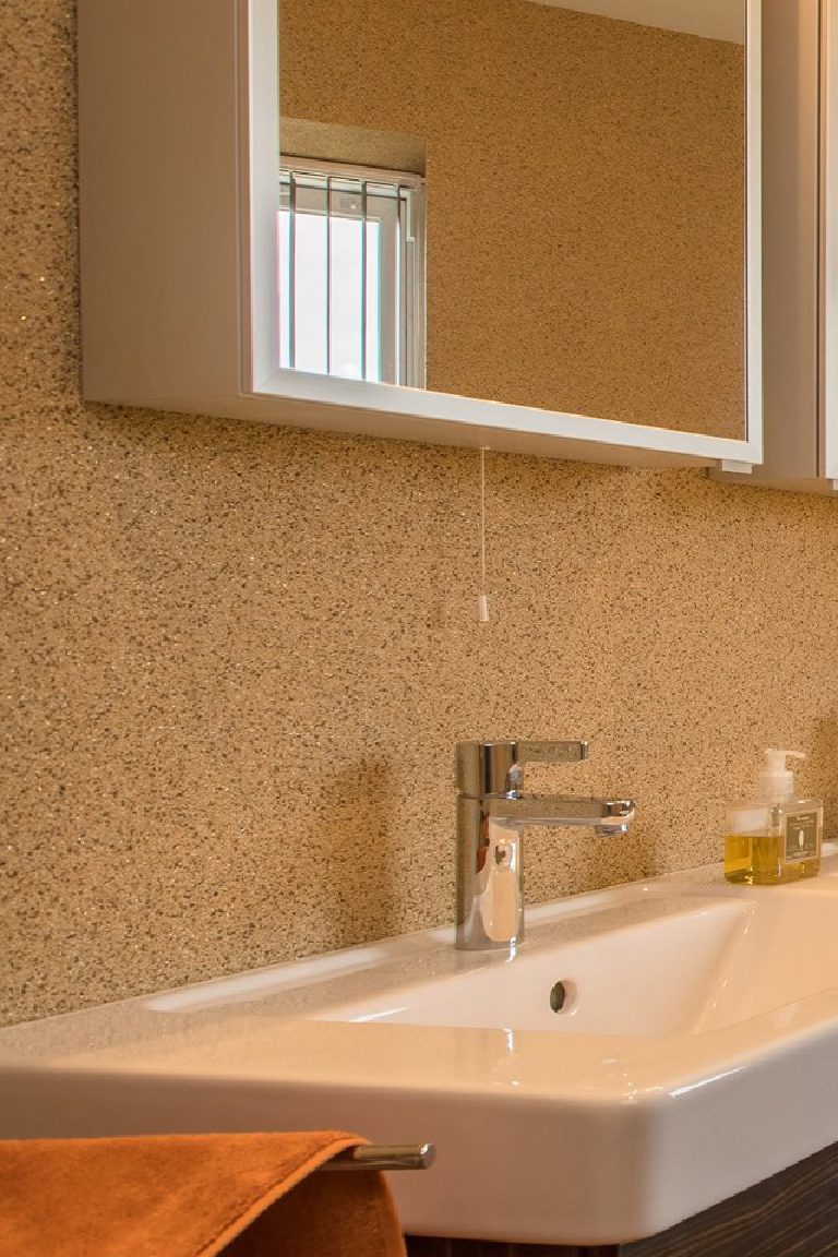 The basin and mirror against the crystal quartz wall