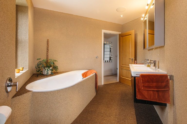 The bath and vanity seen from the other end of the room
