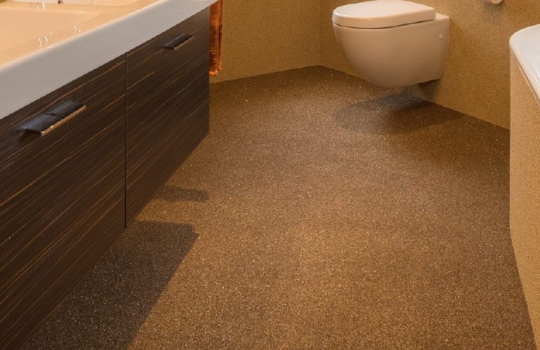 The floor running unbroken from the vanity to the WC