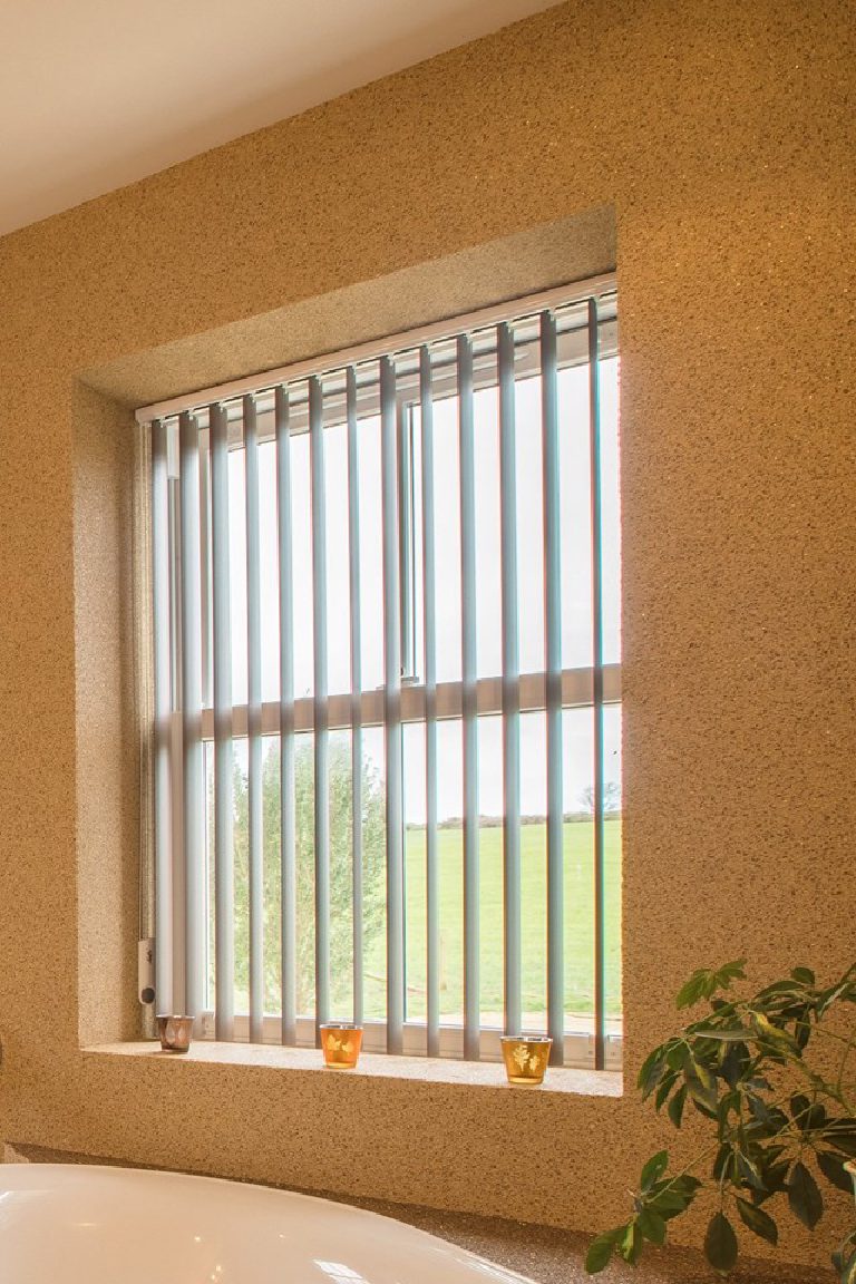 The window reveal finished in the same crystal quartz as the walls