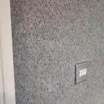 Close-up of the Crystal Quartz finish around a light switch