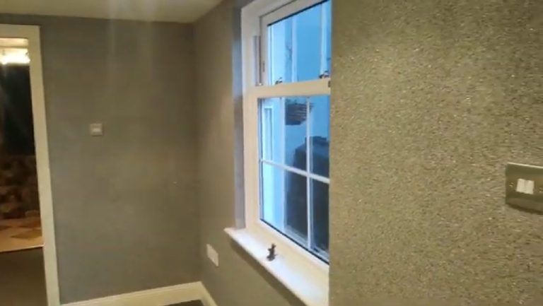 The window wall and the corner beyond it, both in the Crystal Quartz finish