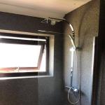 The shower room with daylight across the quartz wall