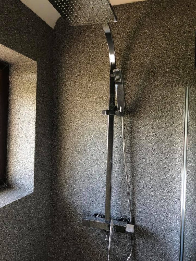 The shower controls set into the seamless quartz