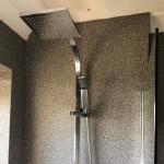 The shower on the seamless quartz wall