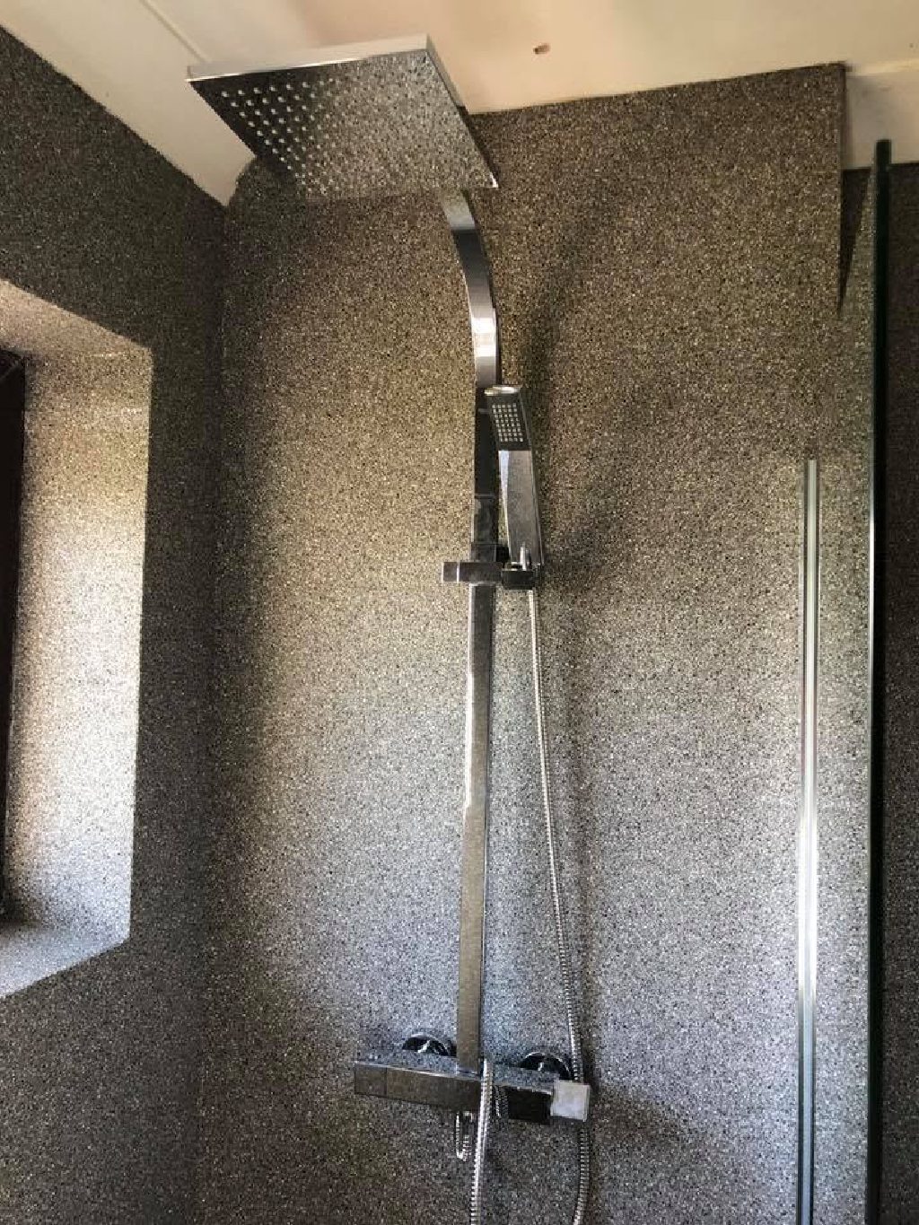 The shower on the seamless quartz wall