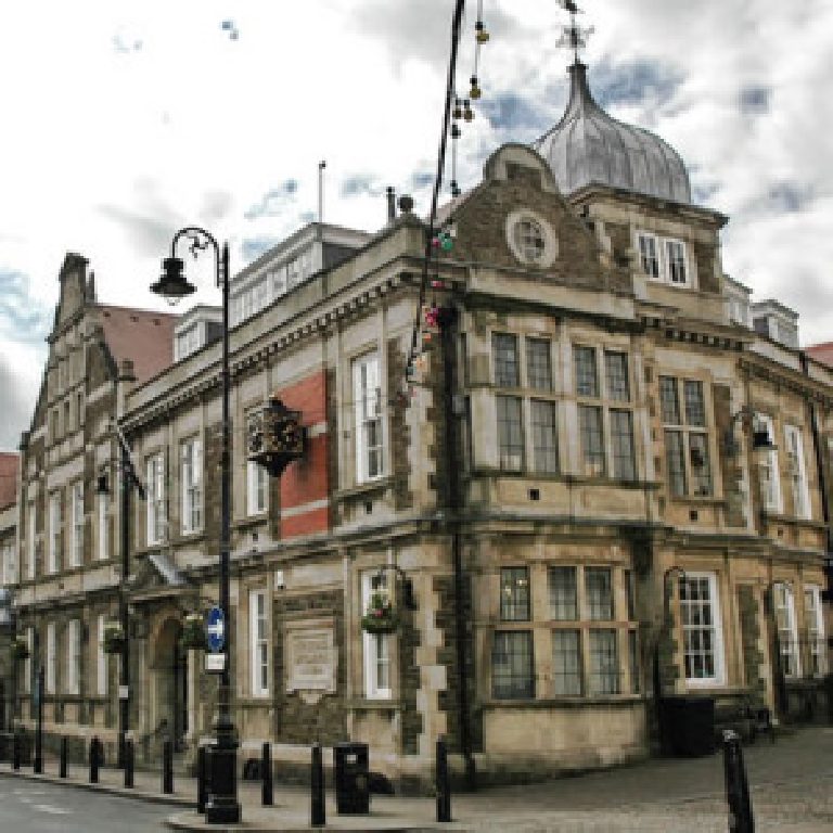 Douglas Town Hall before restoration, its sandstone dark and weathered