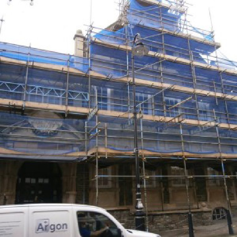 Douglas Town Hall wrapped in scaffolding and blue netting