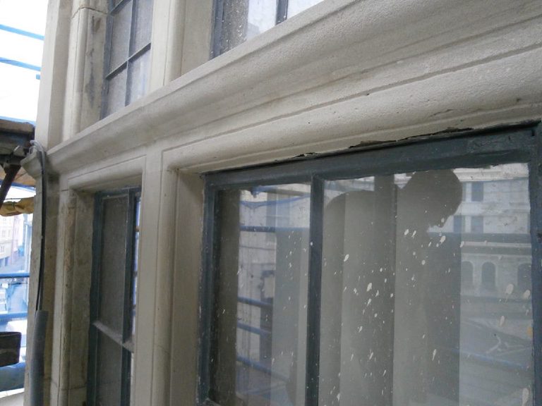 Stone repairs taking shape around the window mullions, seen from the scaffold