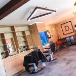 The finished barbershop with its distressed concrete walls