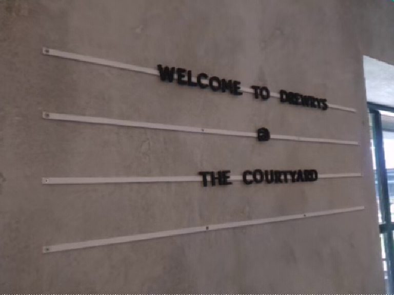 Welcome to Drewry's, The Courtyard, lettered onto the plastered wall