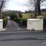 The finished driveway entrance with matching rendered pillars