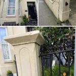 The house before the work — flat cream front, maroon brackets, streaked boundary wall and gate pier