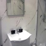 White Marmorino with shards of Gunmetal Grey