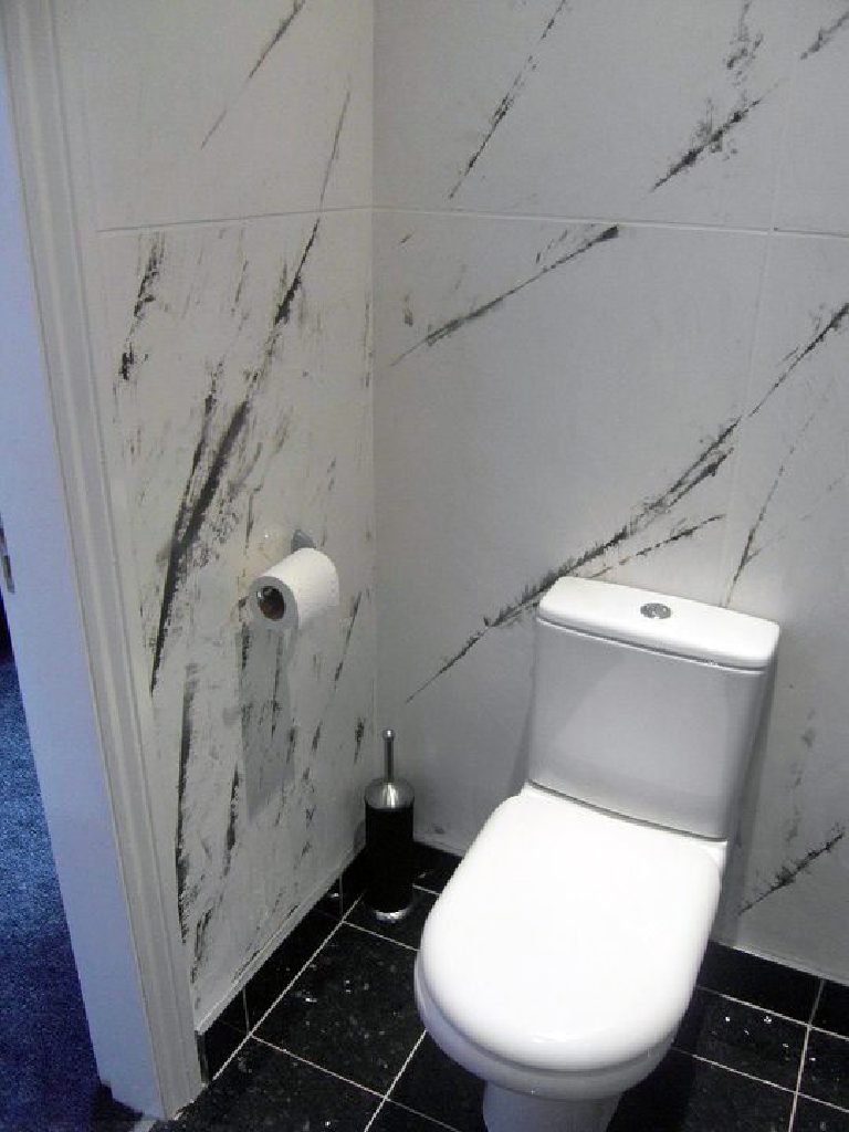 White Marmorino with shards of Gunmetal Grey