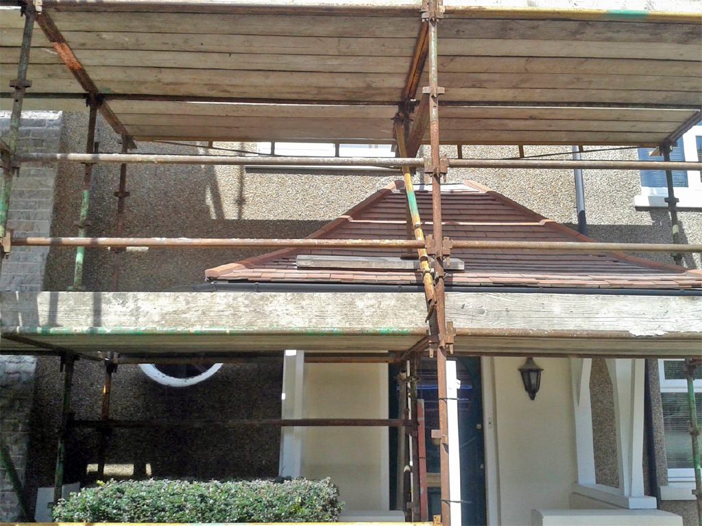 New porch roof and dashed walls during the refurbishment