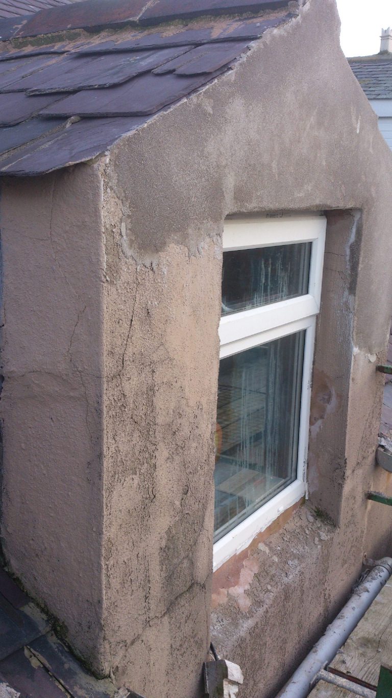 Tired and damaged building before external wall insulation and lightweight render